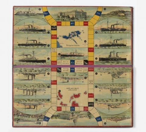 Colorful board game featuring pictures of battleships and maps.