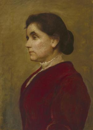 Bust length portrait of a dark-haired woman. She faces left and wears a red dress.