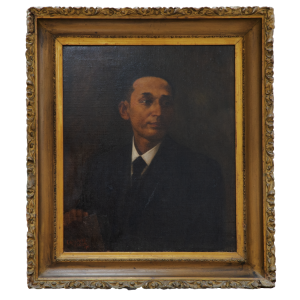 Bust-length painting of a man in a dark suit with his head turned toward the right.
