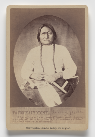 Carte de Visite of a Native American man with long braid, dressed in light clothing.