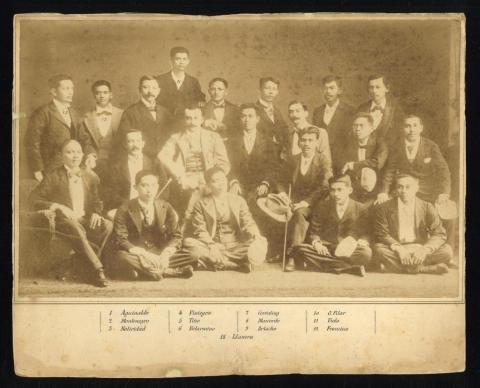 Group of men in suits posing in a group.